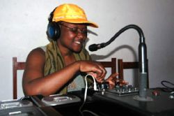 Volunteers moderate the community radio in Mozambique) which is part of a UNESCO initiative for Community Multimedia Centres (CMCs)