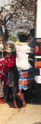 The daily hurry to board the bus (Bangladesh)