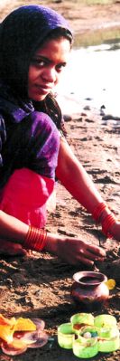 Worshipping at the Narmada river in India