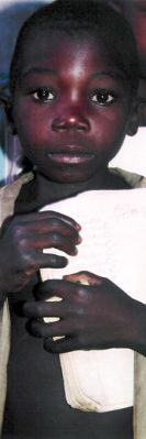 A Mozambican boy returning from school